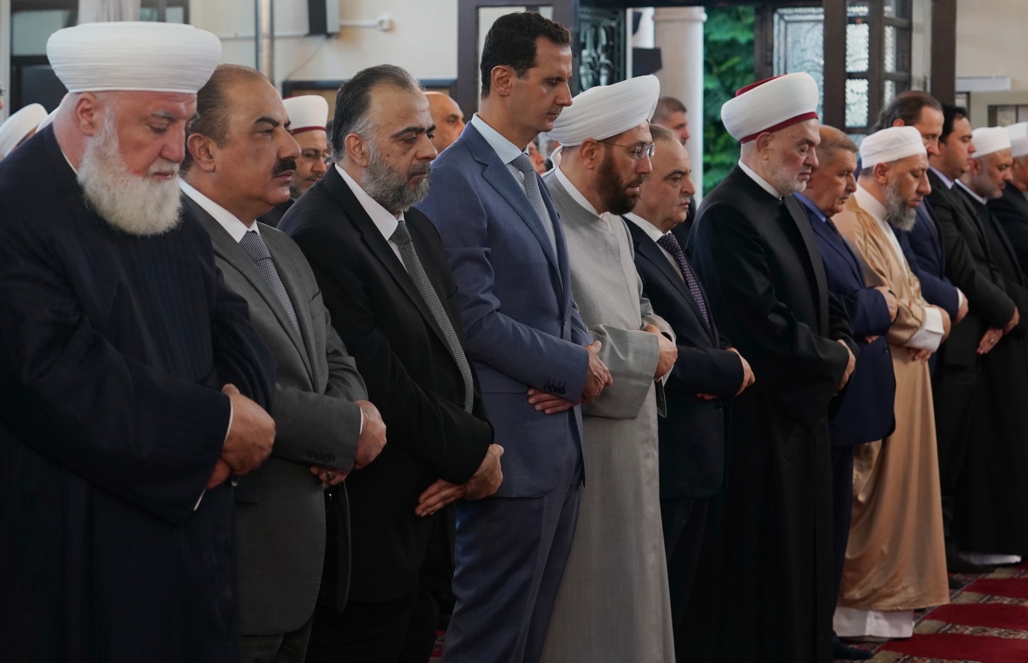 ދިމިޝްގު: އޮގަސްޓް 11، 2019: ސީރިއާގައި ކުރި އީދު ނަމާދުގައި ރައީސް ބައްޝާރުލް އަސަދު (މ) ބައިވެރިވެވަޑައިގަންނަވަނީ. --ފޮޓޯ:އޭއެފްޕީ