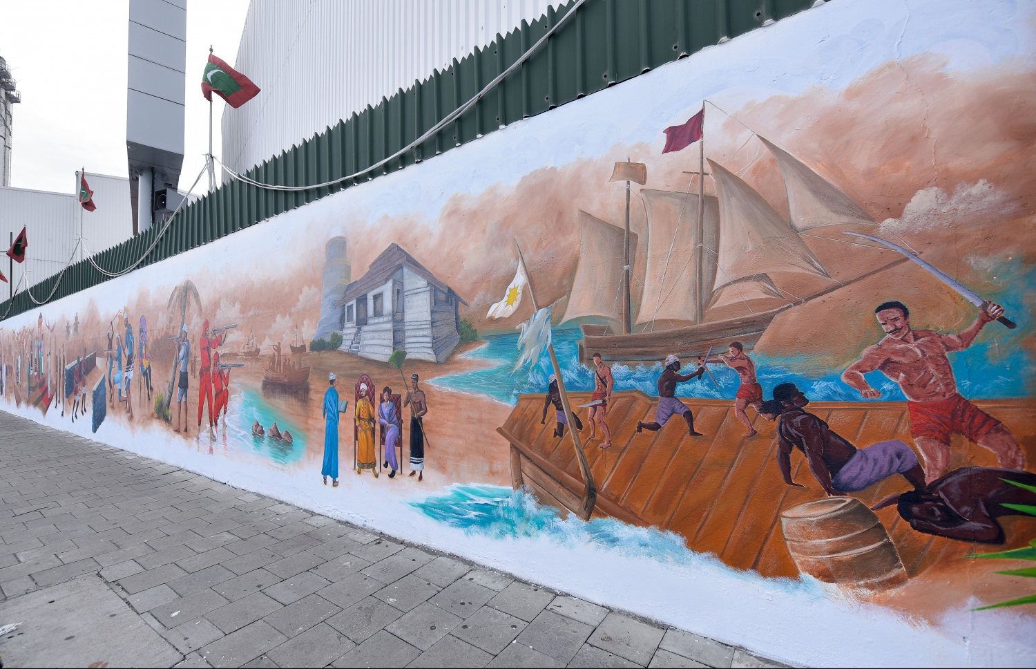 މާލެ- ޖުލައި 27، 2021: ރާއްޖޭގެ 56 ވަނަ މިނިވަން ދުވަހުގެ މުނާސަބަތުގައި، ހޯމް މިނިސްޓްރީން އިންތިޒާމްކޮށްގެން، ދިވެހިން މިނިވަންކަމަށް ކުރި ދަތުރު ދައްކުވައިދޭ ދިވެހި އާޓިސްޓުންގެ ކުރެހުންތައް ސްޓެލްކޯ ފާރުގައި ކުރަހާފައި. --ފޮޓޯ: ނިޝާން އަލީ/ މިހާރު