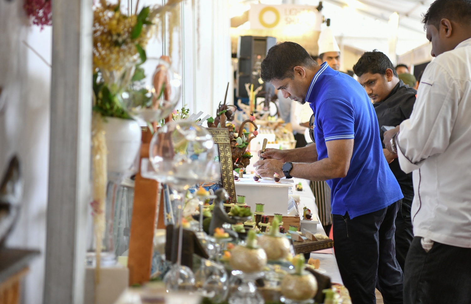 ރާއްޖޭގައި ބާއްވާ ފުޑް އެންޑް ހޮސްޕިޓައިލިޓީ އޭޝިއާ މޯލްޑިވްސް ފެއާގެ ސްޓޯލެއް --. ފޮޓޯ: ނިޝާން އަލީ/މިހާރު