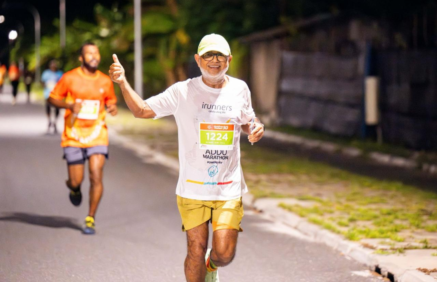 ދިރާގު ފުވައްމުލައް ރަންގެ ހާފް މެރެތަން ދުވުމުގެ ބައިވެރިން ދުވަނީ. -- ފޮޓޯ: ދިރާގު