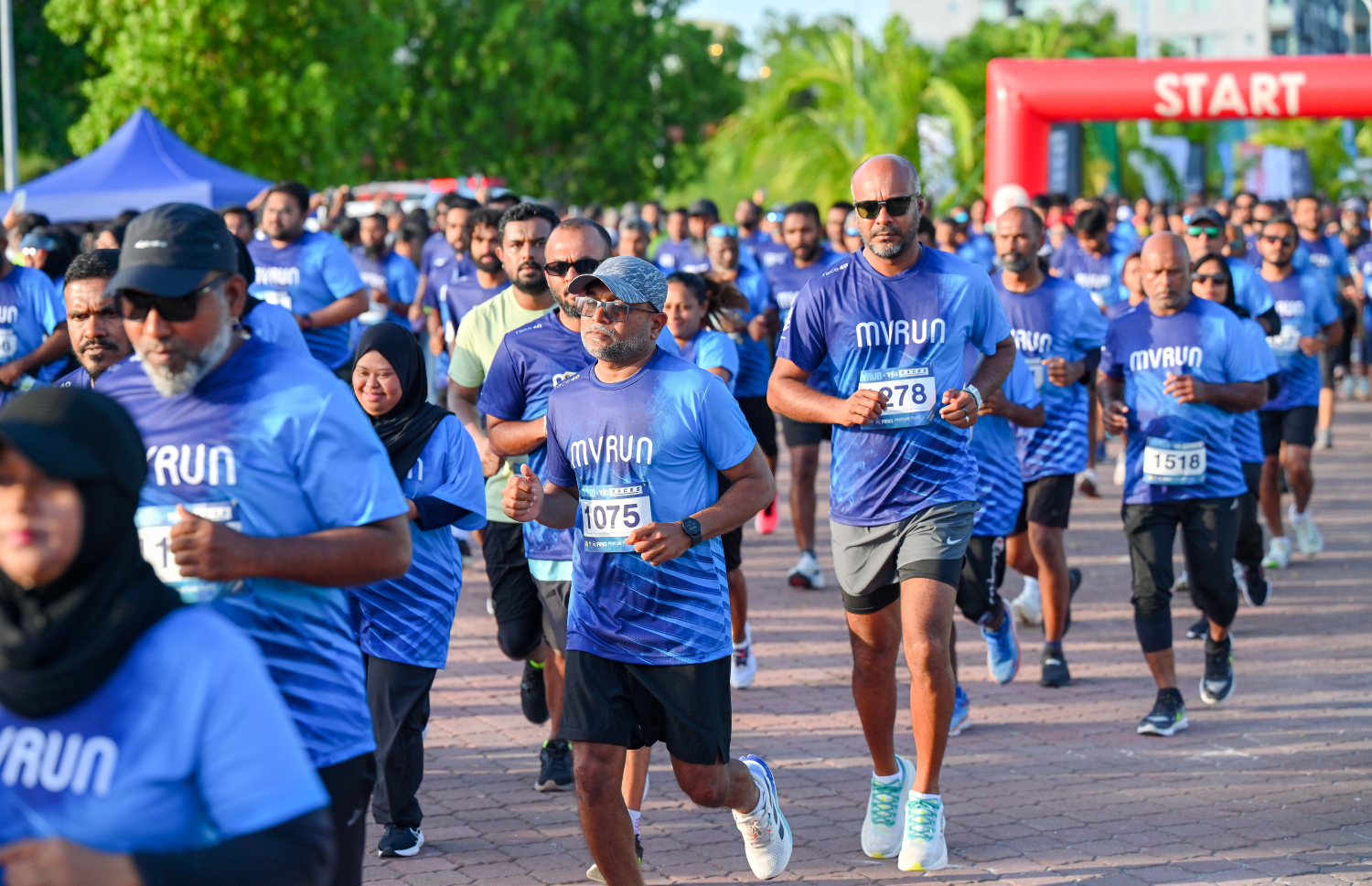 ރާއްޖޭގެ އެންމެ ބޮޑު އެއް ޖިމް، ޓީއެފްޖީ، އިން އިންތިޒާމްކޮށް މިއަދު ހުޅުމާލޭގައި ބޭއްވި "އެމްވީ ރަން"ގެ ބައިވެރިން  ދުވަނީ.-- ފޮޓޯ: ނިޝާން އަލީ | މިހާރު