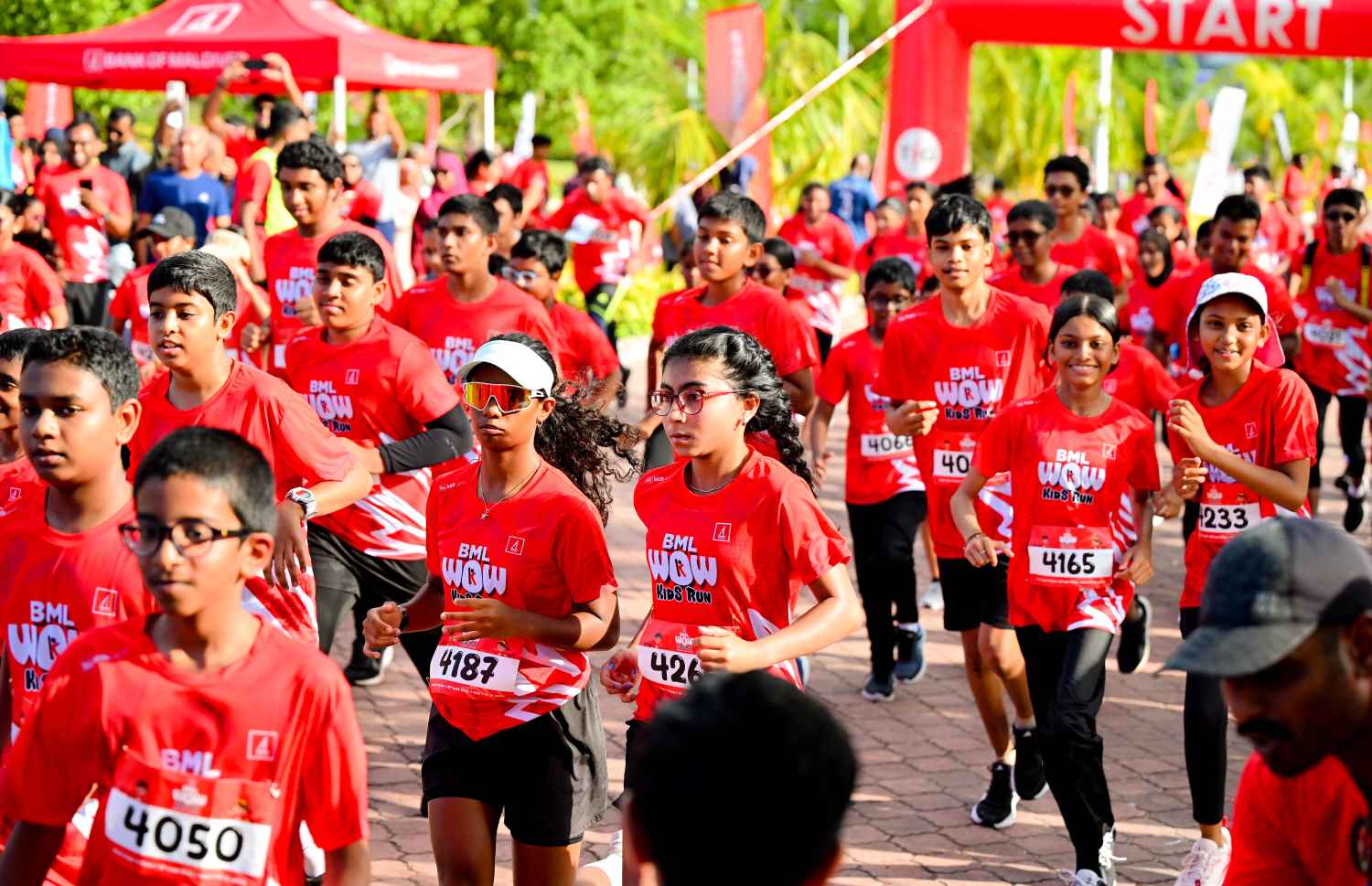 ބީއެމްއެލް އާއި ޓޯޓަލް ފިޓްނަސް ގްރޫޕް (ޓީއެފްޖީ) ގުޅިގެން މިއަދު ހުޅުމާލޭގައި ބޭއްވި ބީއެމްއެލް ވާއު ކިޑްސް ރަންގައި ބައިވެރިވި ދުވުންތެރިން.-- ފޮޓޯ: ނިޝާން އަލީ | މިހާރު